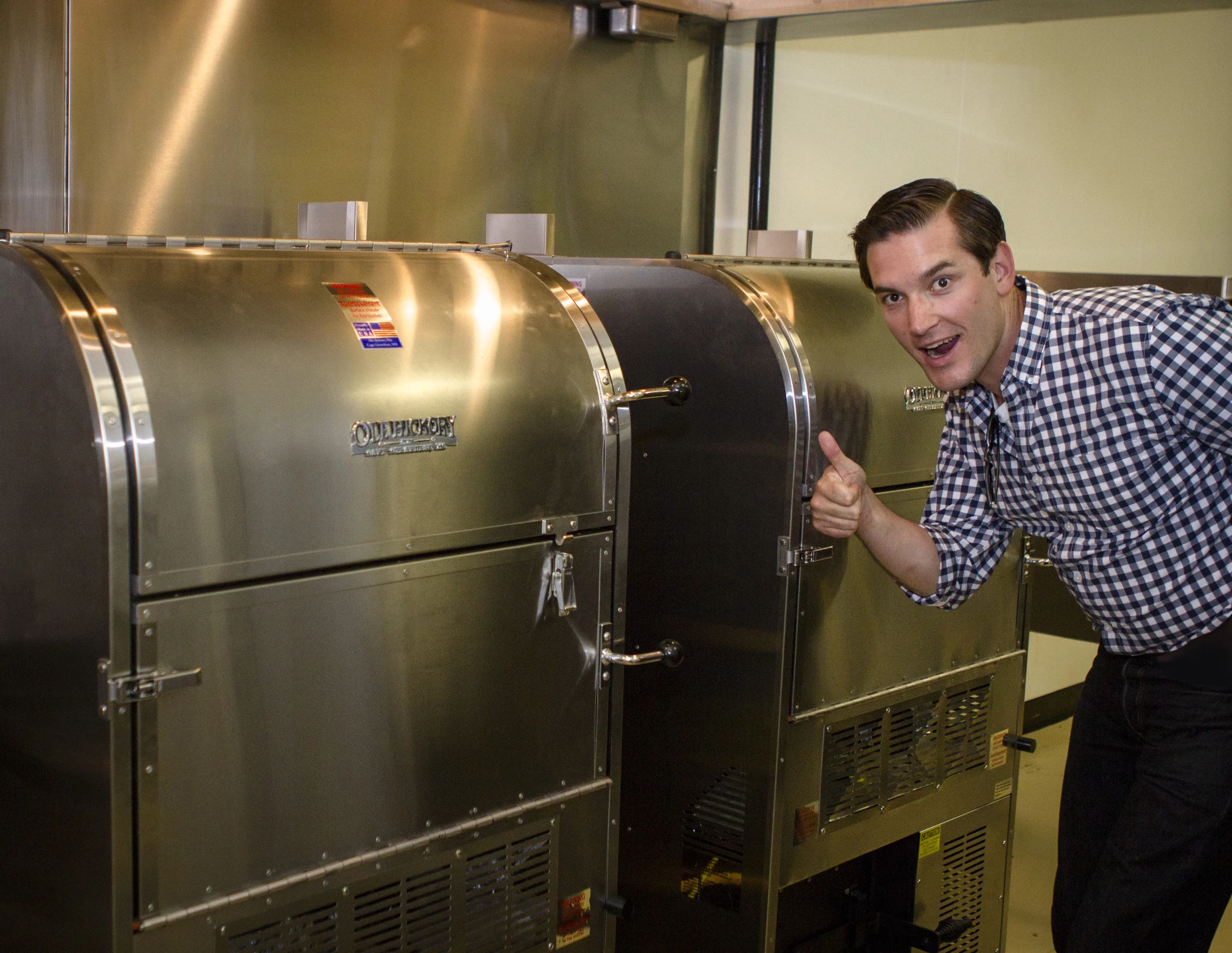 Glen Farris inspects the custom made industrial smokers inside of the forthcoming Goldmine BBQ. 