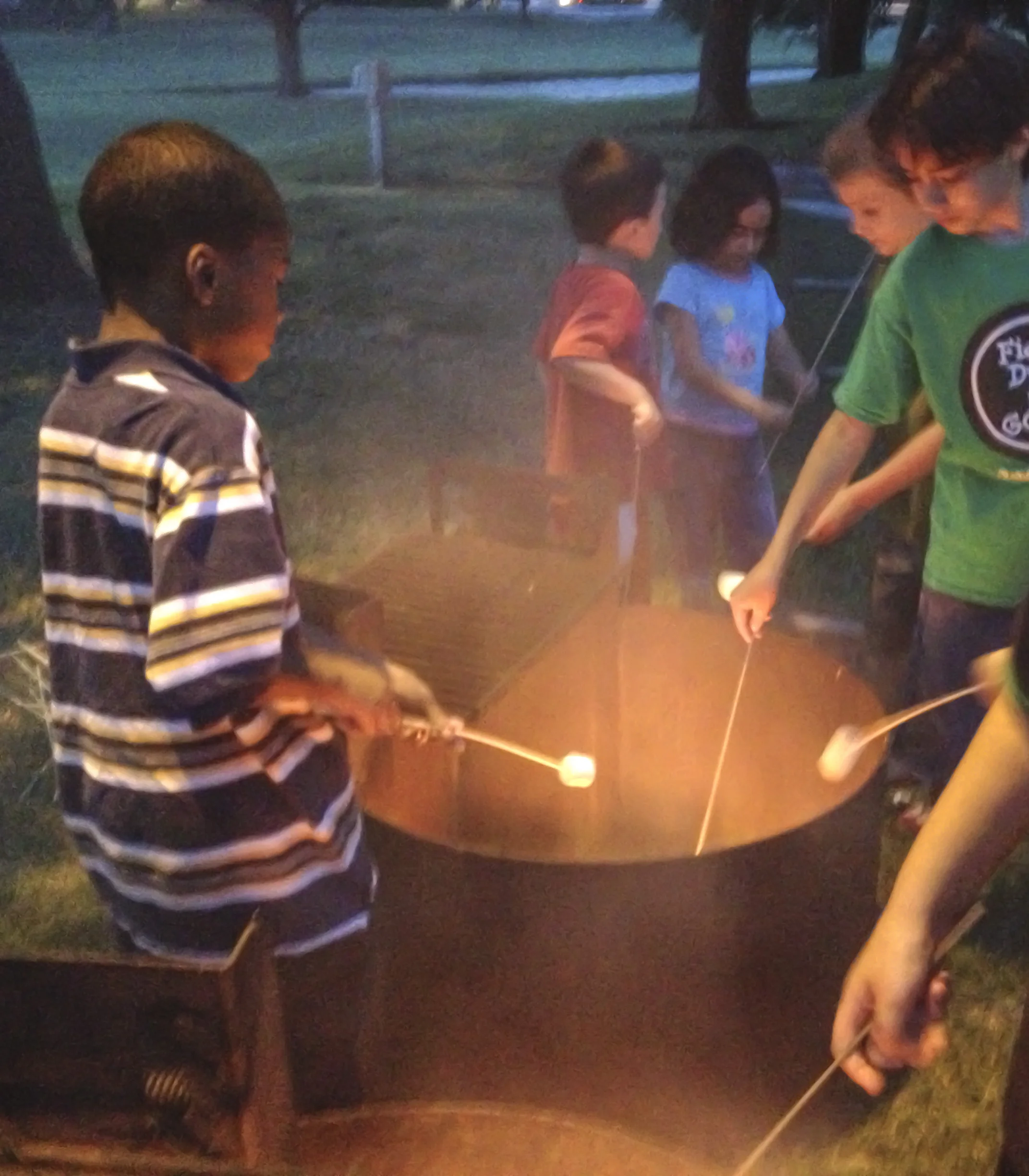 Children in Denton roasted marshmallows and danced before the start of Puss in Boots last week at Movie in the Park. 