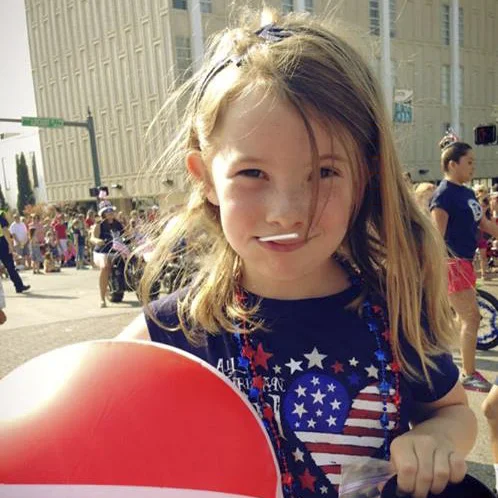 Kiddos jumped at the chance to fill up their pockets (or cups) with candy thrown from various parade floats.&nbsp;