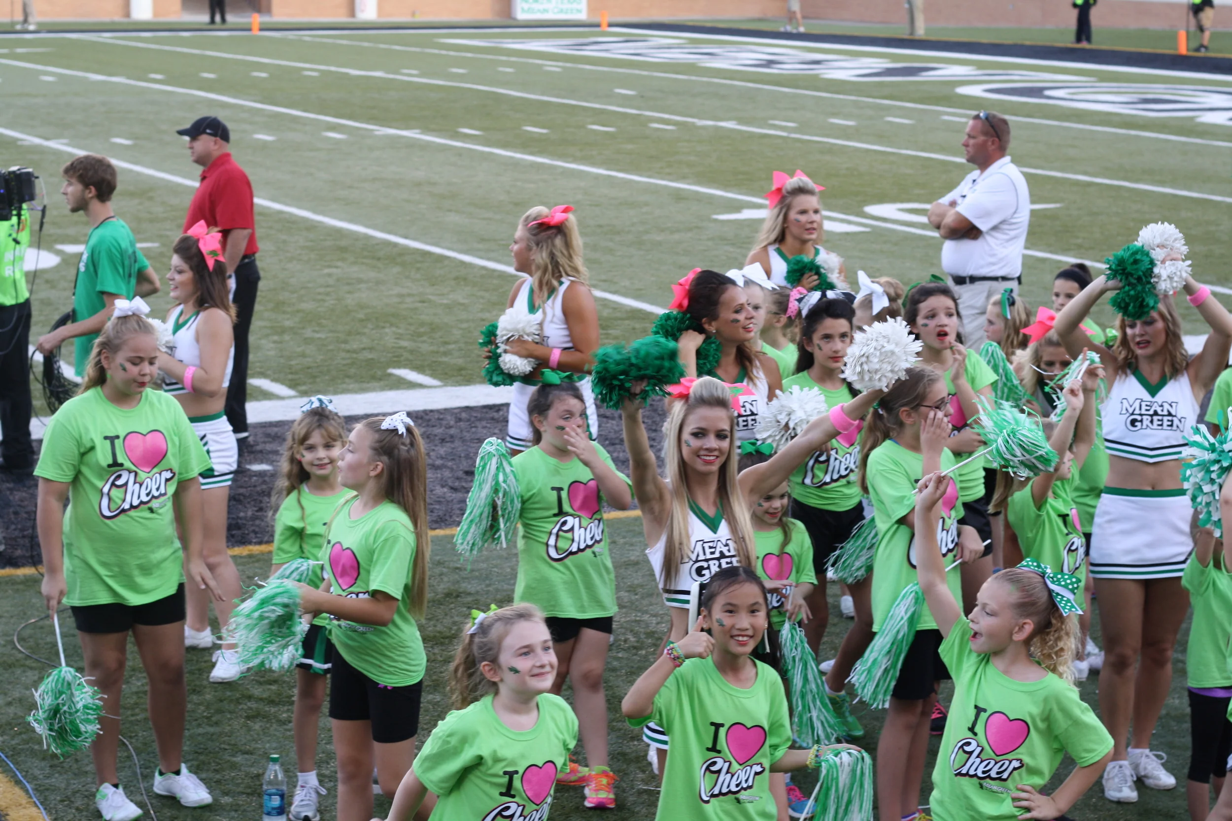 Speaking of spirit being taught to future generations - we're pretty convinced 'cheer camp' is just code for little kids bouncing around on the side lines. It's cool - its so dang cute we'll let it slide. 
