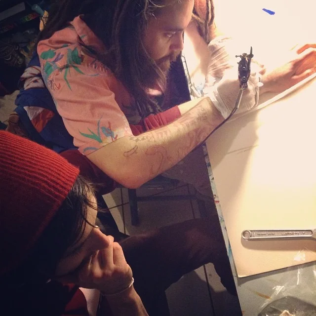 A bunch of folks got lowercase "d" "Denton tattoos" at a tattoo party. Now we're thinking we might need some WDDI temporary tattoos. Photo by Camille Green. 