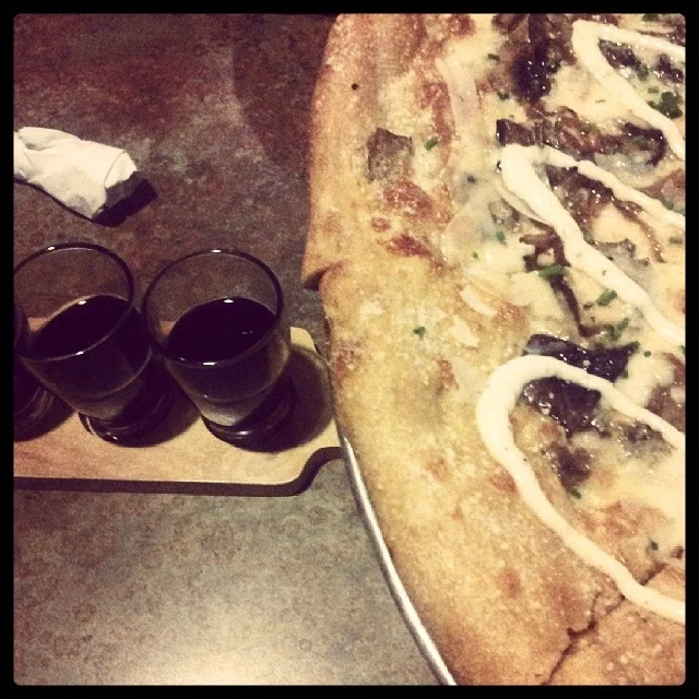 Some Mellow Mushroom and a beer flight. Photo by @DentonKate . 