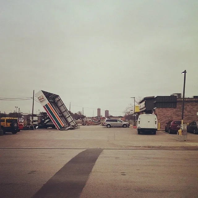 The wind knocked over 7-11. Like, literally knocked it over. This, coupled with the portion of the car wash place across the street that fell over two ice storms ago makes us think this stretch of University gets the worst of Denton weather. Photo by @thedapperbat. 