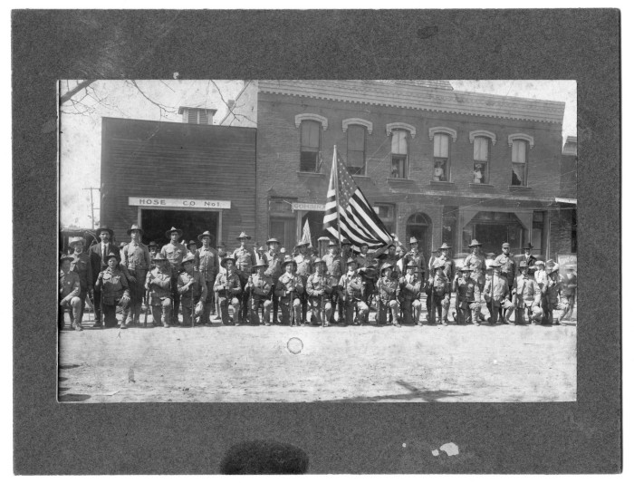 A 1914 group photo of World War I soldiers in front of the fire station on West Oak Street.