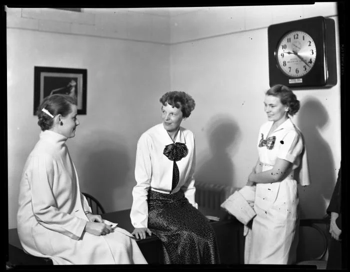 Amelia Earhart chats with two unidentified TWU Pioneers during her 1936 visit to Denton TX. Photo courtesy of the Portal to Texas History . 