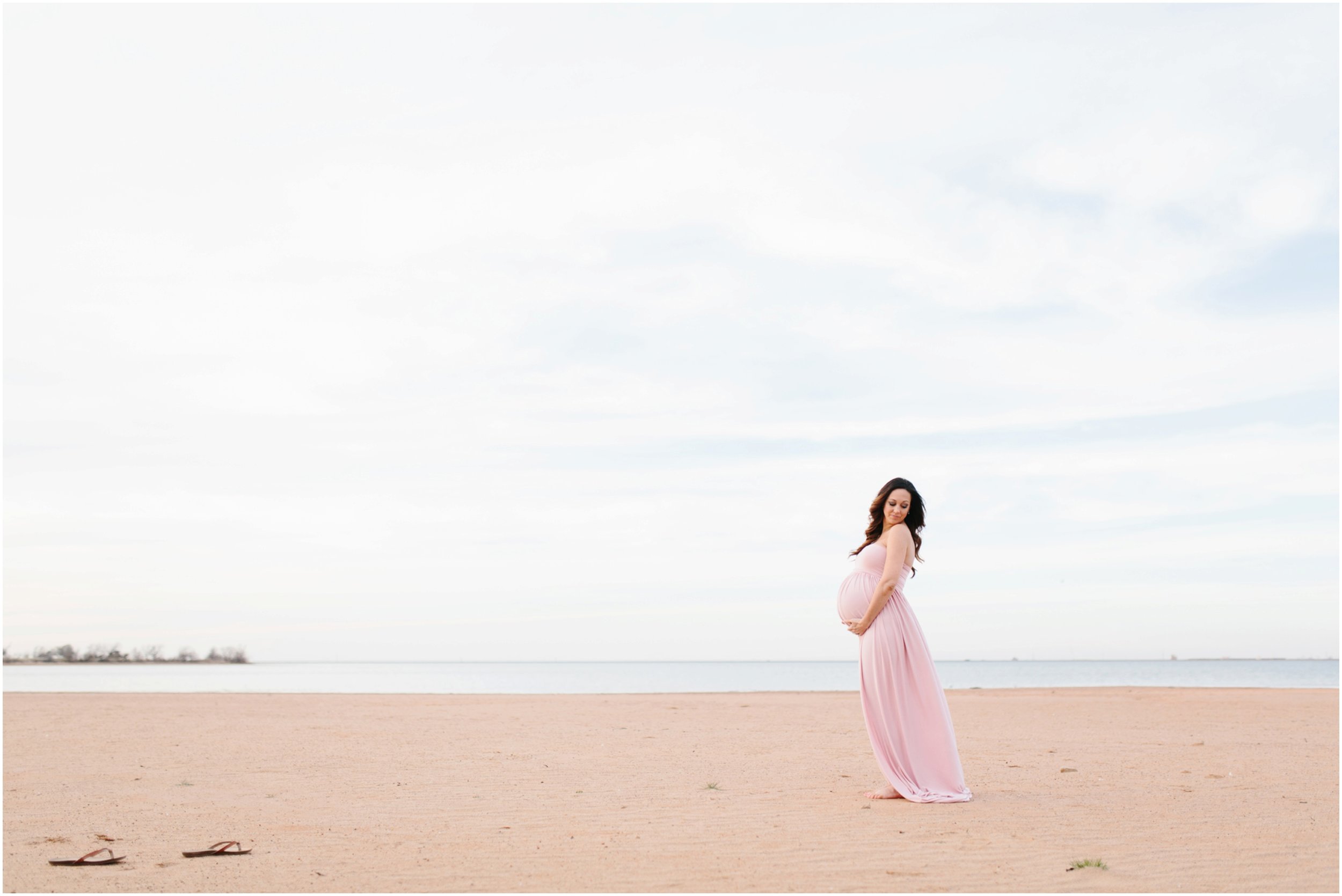 expecting mother portraits on beach at lake in midwest