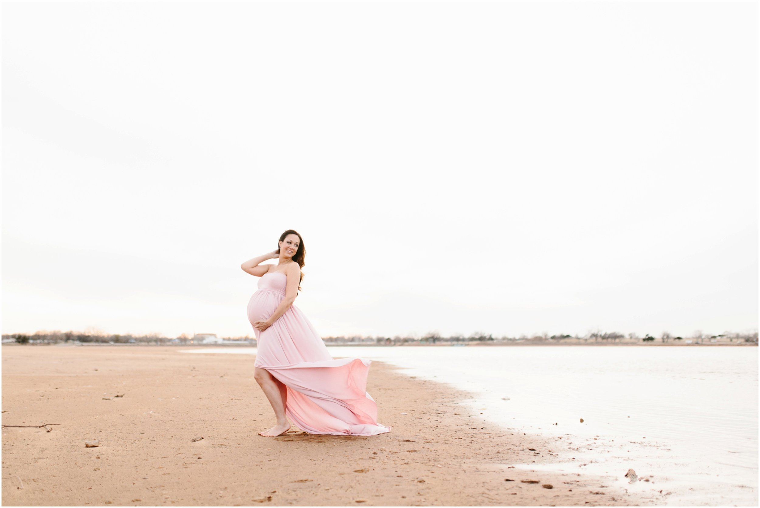 new mother-to-be maternity photos at lake in long dress