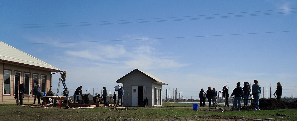 Hugh and Ramona Shields Home with GWU Volunteers.png