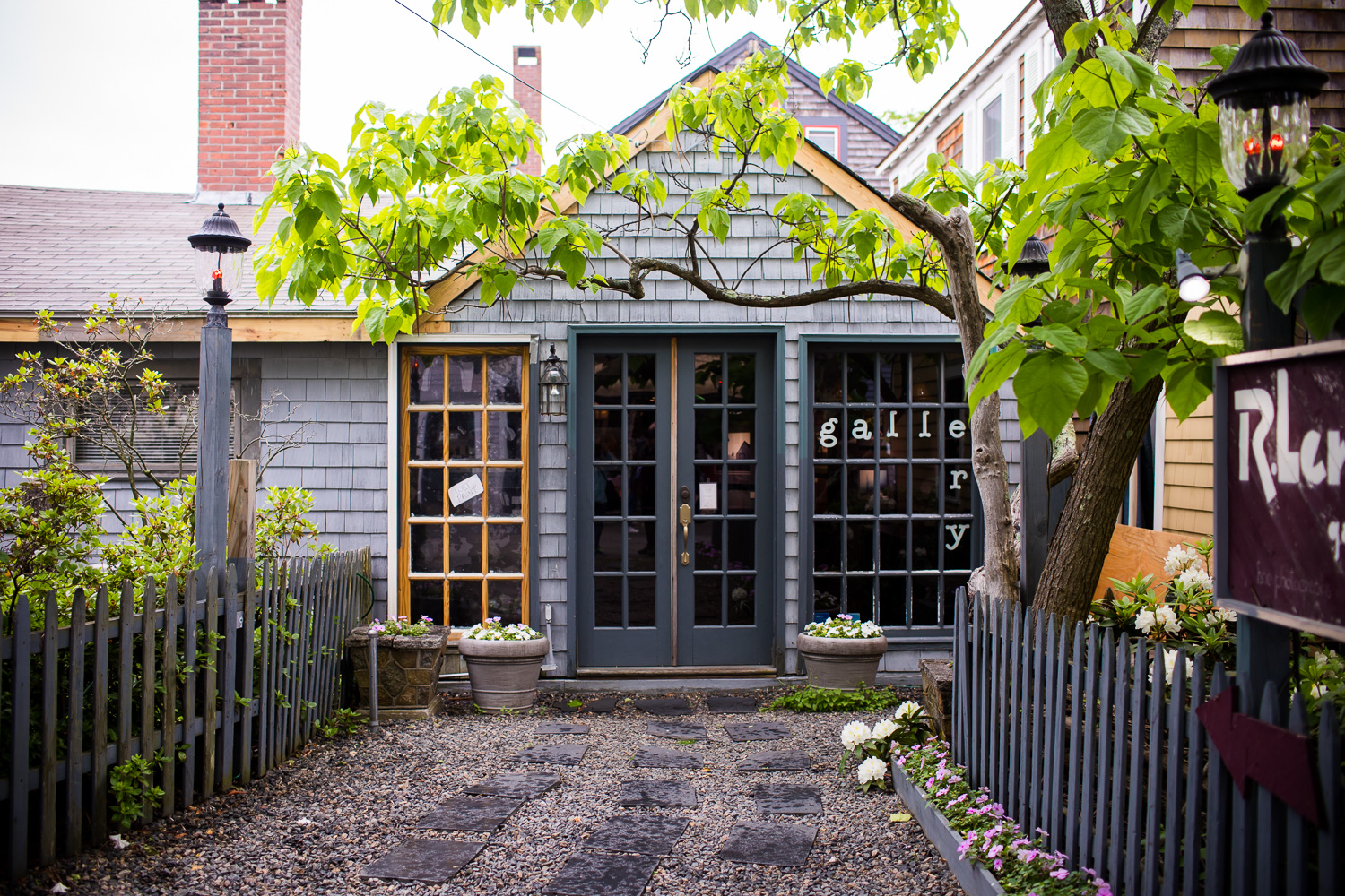 A gravel-lined walkway to a gallery on Bearskin Neck in Rockport, MA.