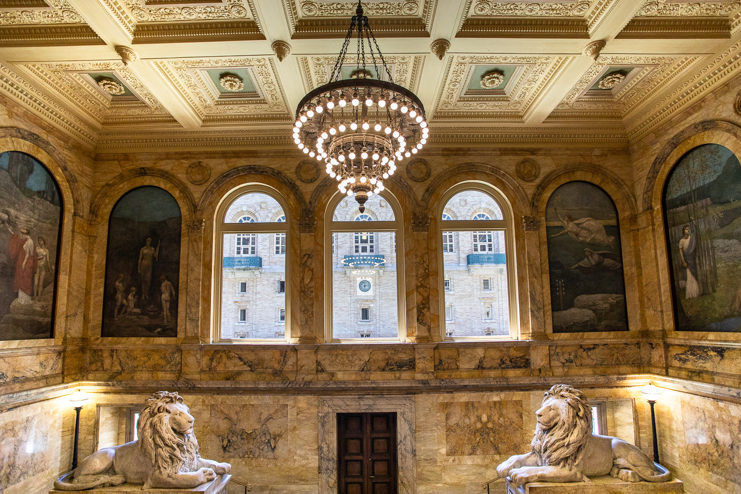 The lion sculptures in front of the grand staircase in the Boston Public Library.