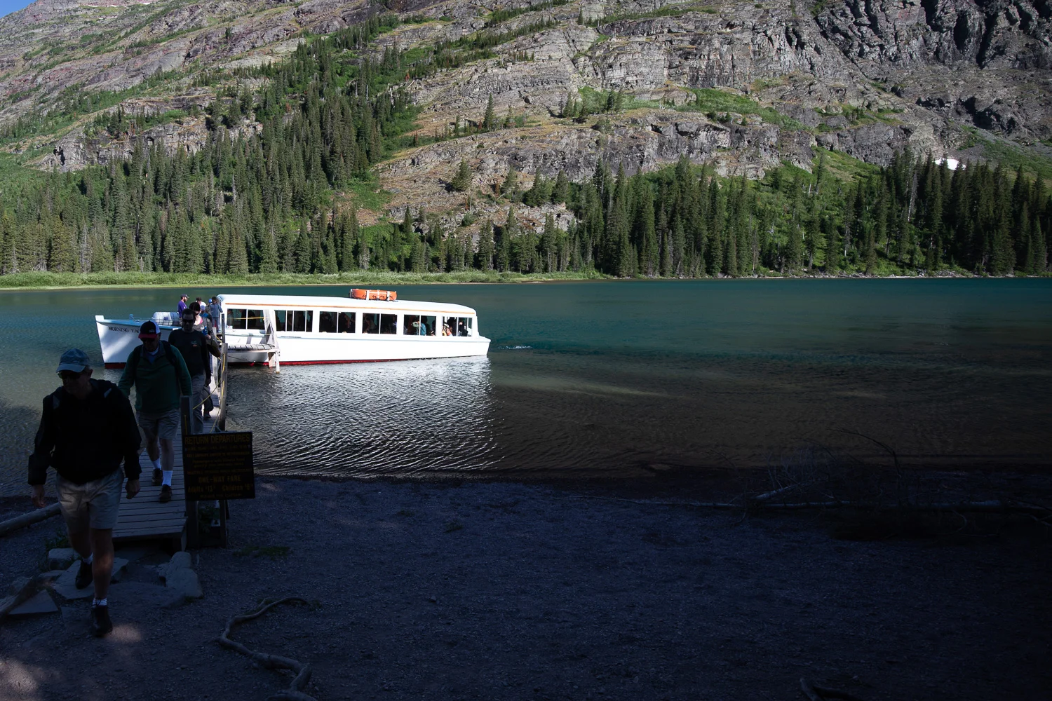 Passengers departing the Morning Eagle on their way to traverse the Grinnell Glacier trail.