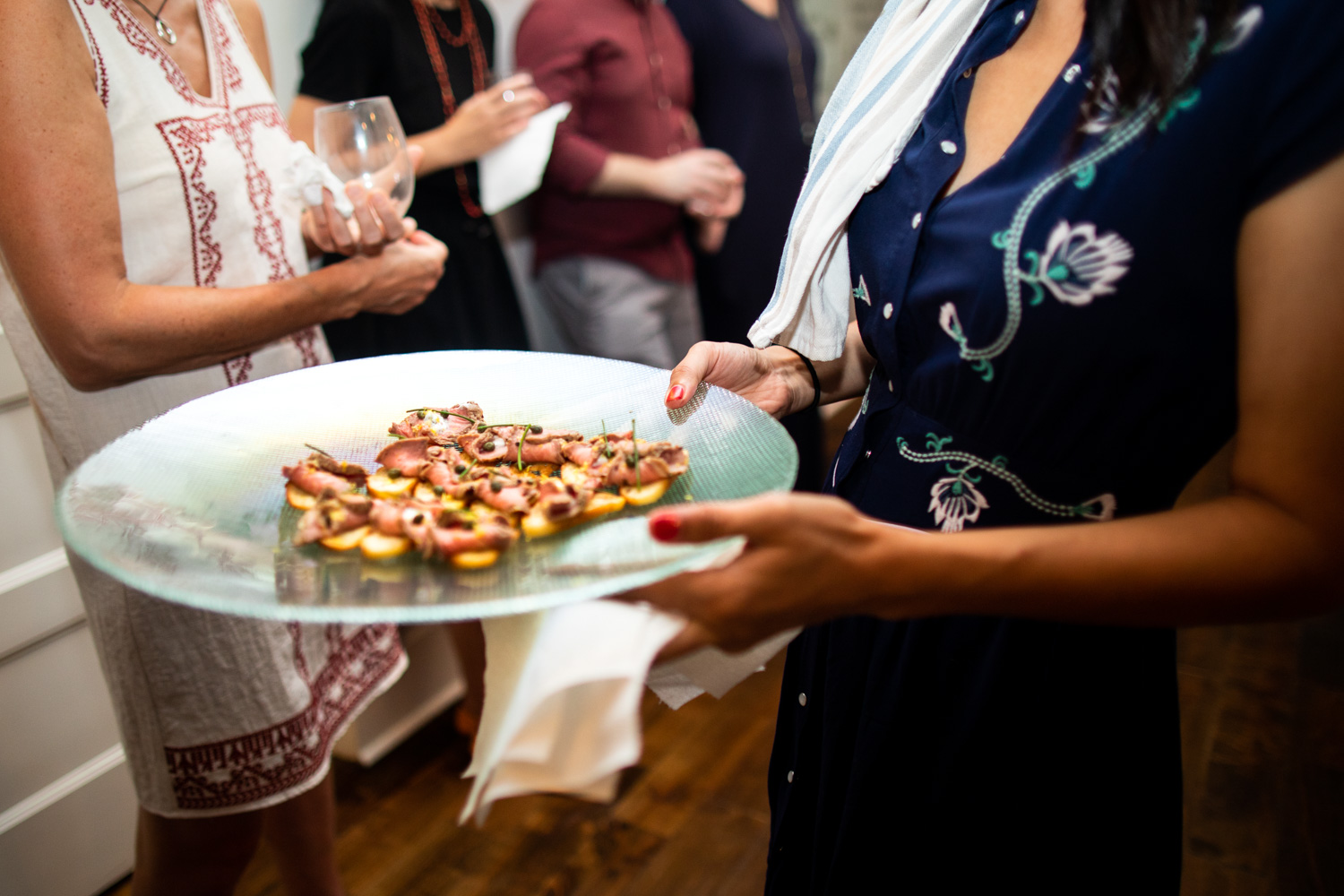 Ria serving the beef tenderloin with dill crème fraîche, horseradish, capers & zest.