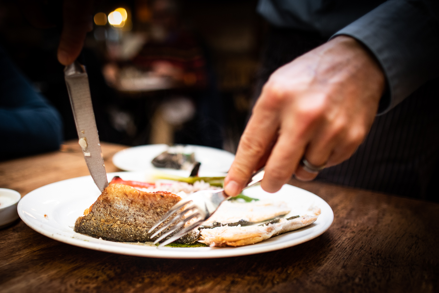 Servicing (de-boning) the trout at the table at Rhubarb.