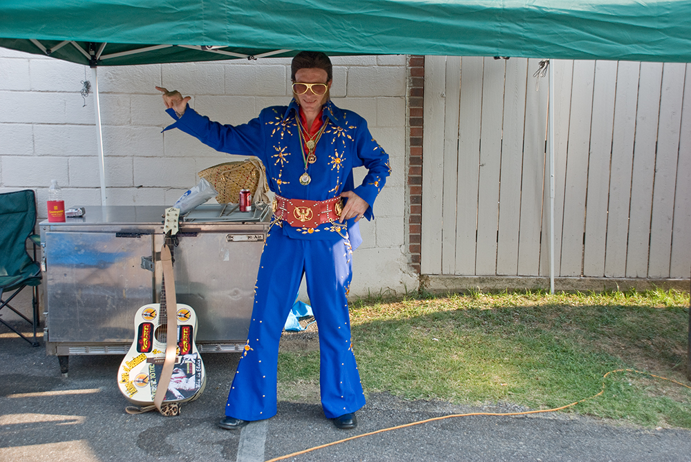 You have to pass rather stringent assessments to be licensed an official Elvis Impersonator. This guy was from Italy, barely spoke English and was camped off the main drag, just down an alley by himself - singing and playing guitar. 
