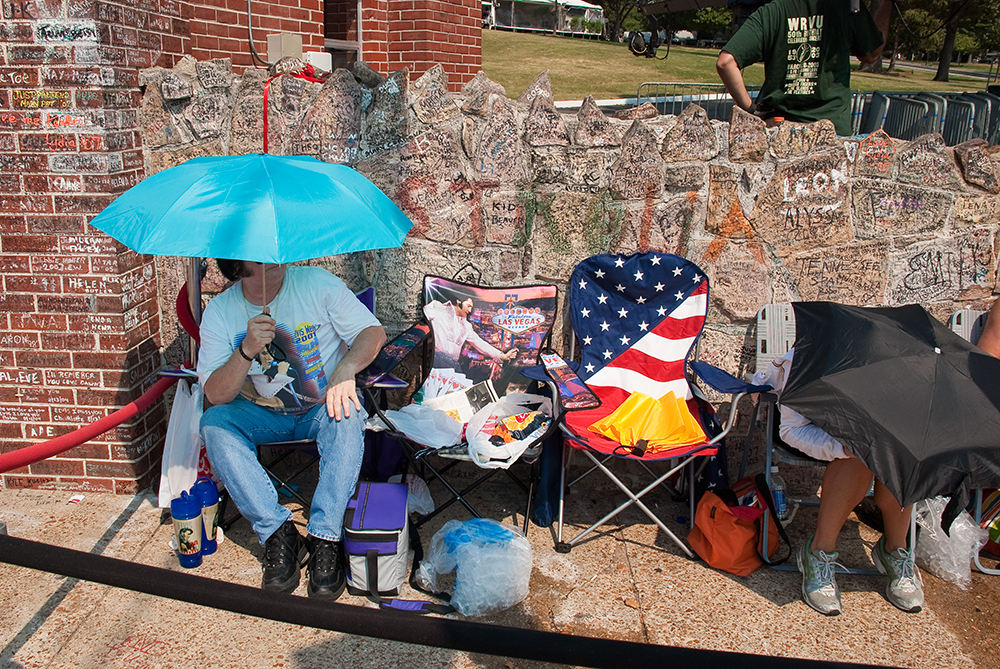 To be first in line at the gates to Graceland takes resiliency and an umbrella.