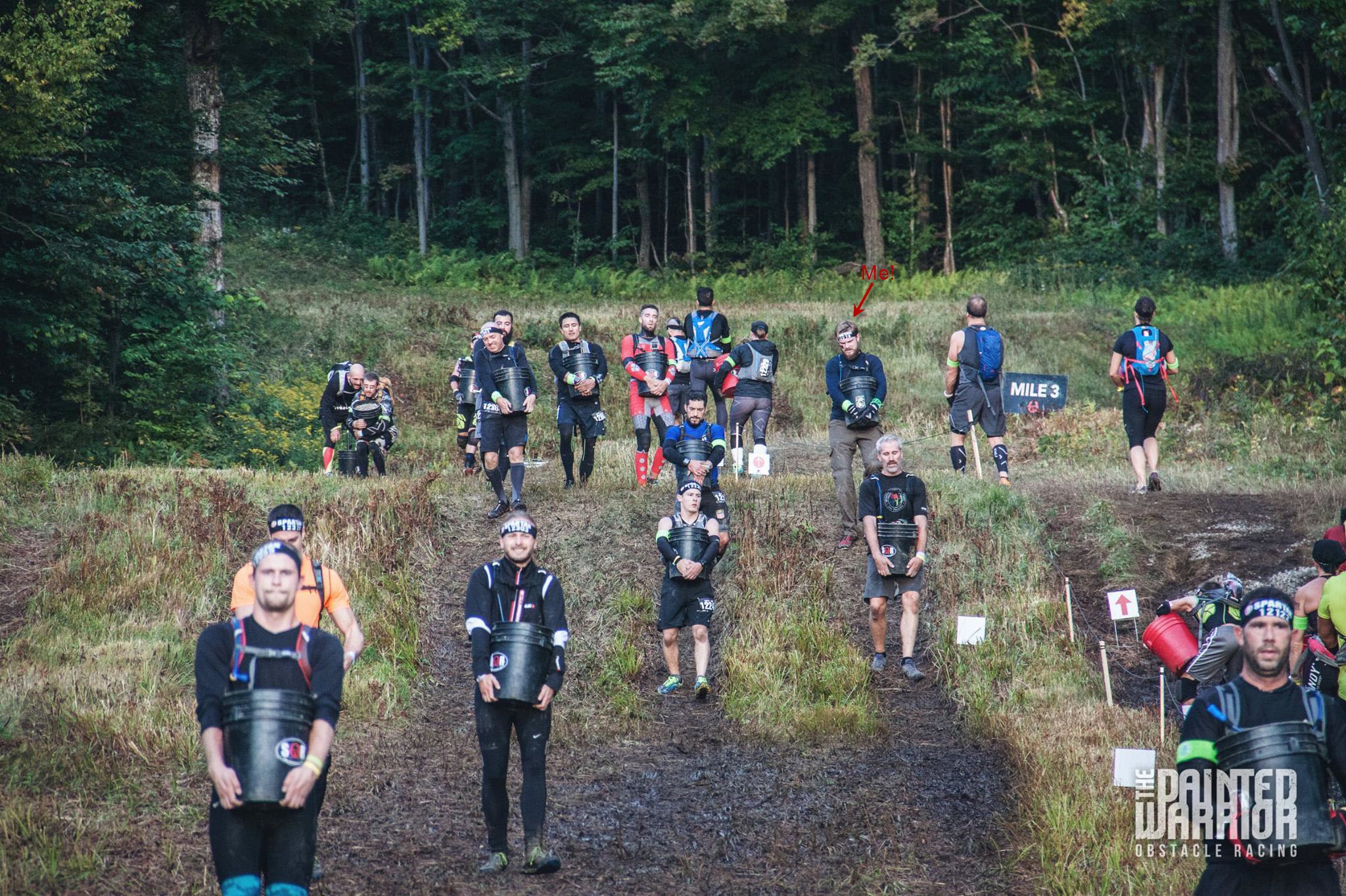 The first bucket brigade obstacle. Picture courtesy of The Painted Warrior (the guy in the red)
