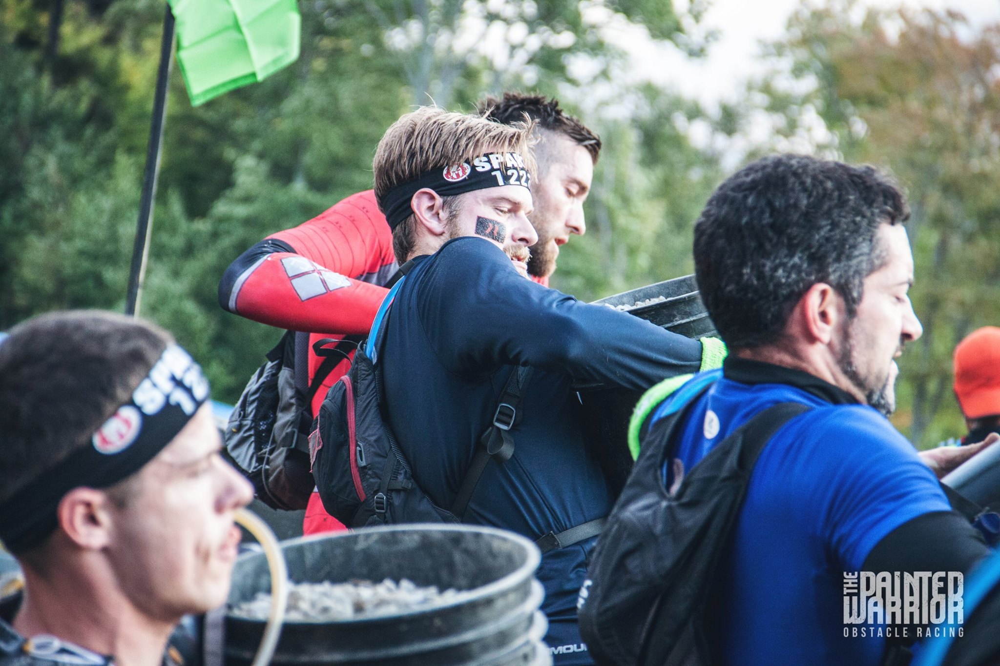 Going through the bucket brigade. Picture courtesy of The Painted Warrior (The guy in the red next to me)