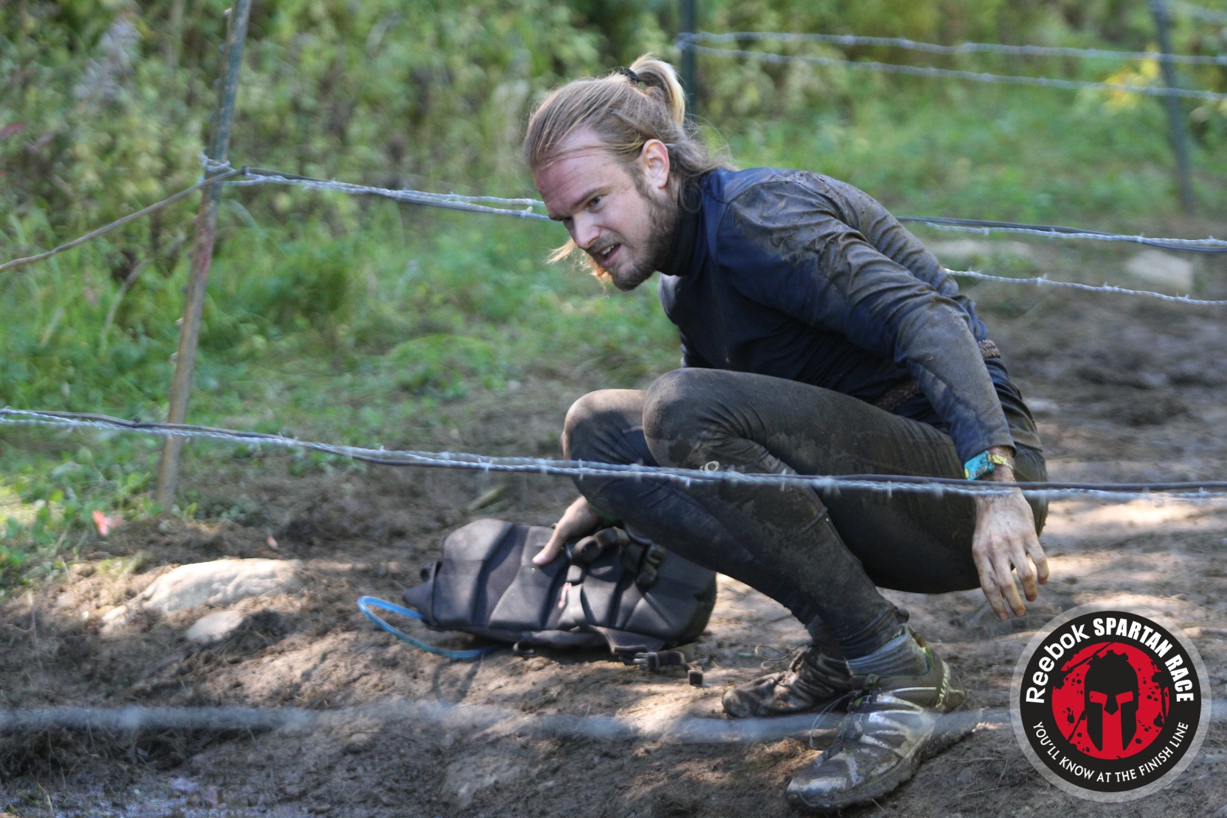 The good ol' barbed wire crawl. Heidi tied me a wicked man-bun.