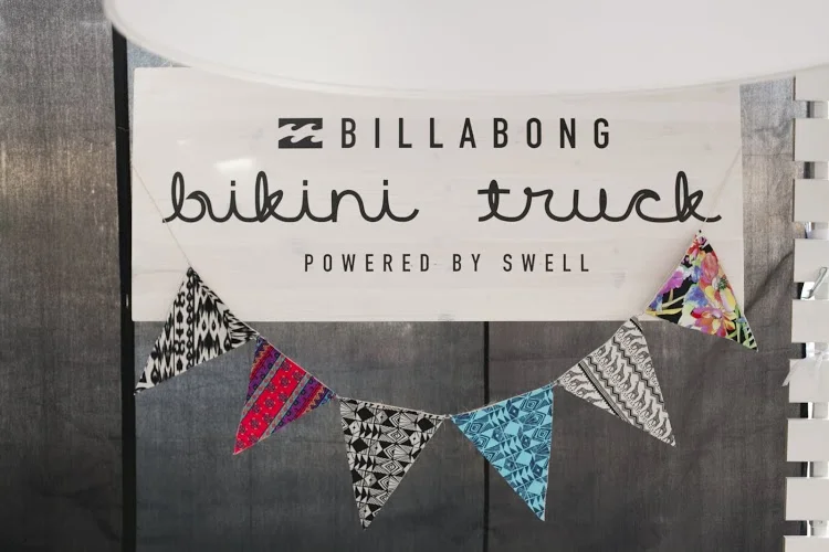  Custom exterior sign with nautical flags. The flag fabric is from the Billabong swimwear collection.&nbsp; 