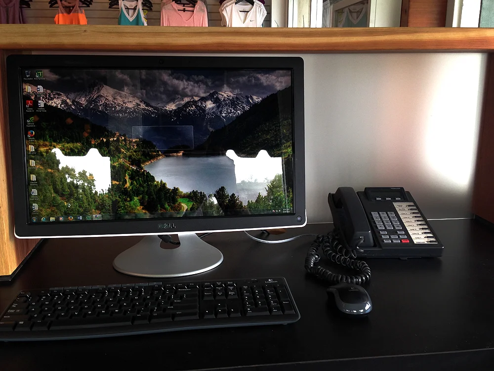 The redwood and acid etched glass computer monitor shrouds tuck away electronics. 