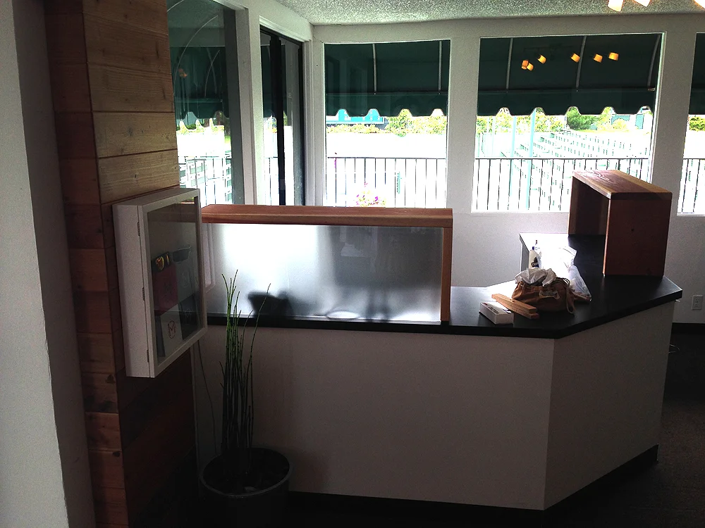 The new custom built court director desk has working areas for two staffers and a better layout to bring in more light and also hide unsightly computers and paperwork. The new eyewear case is seen at left. 