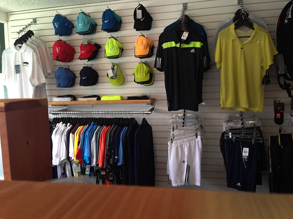 The newly merchandised mens apparel area with redwood shelving to tie into other casework. 