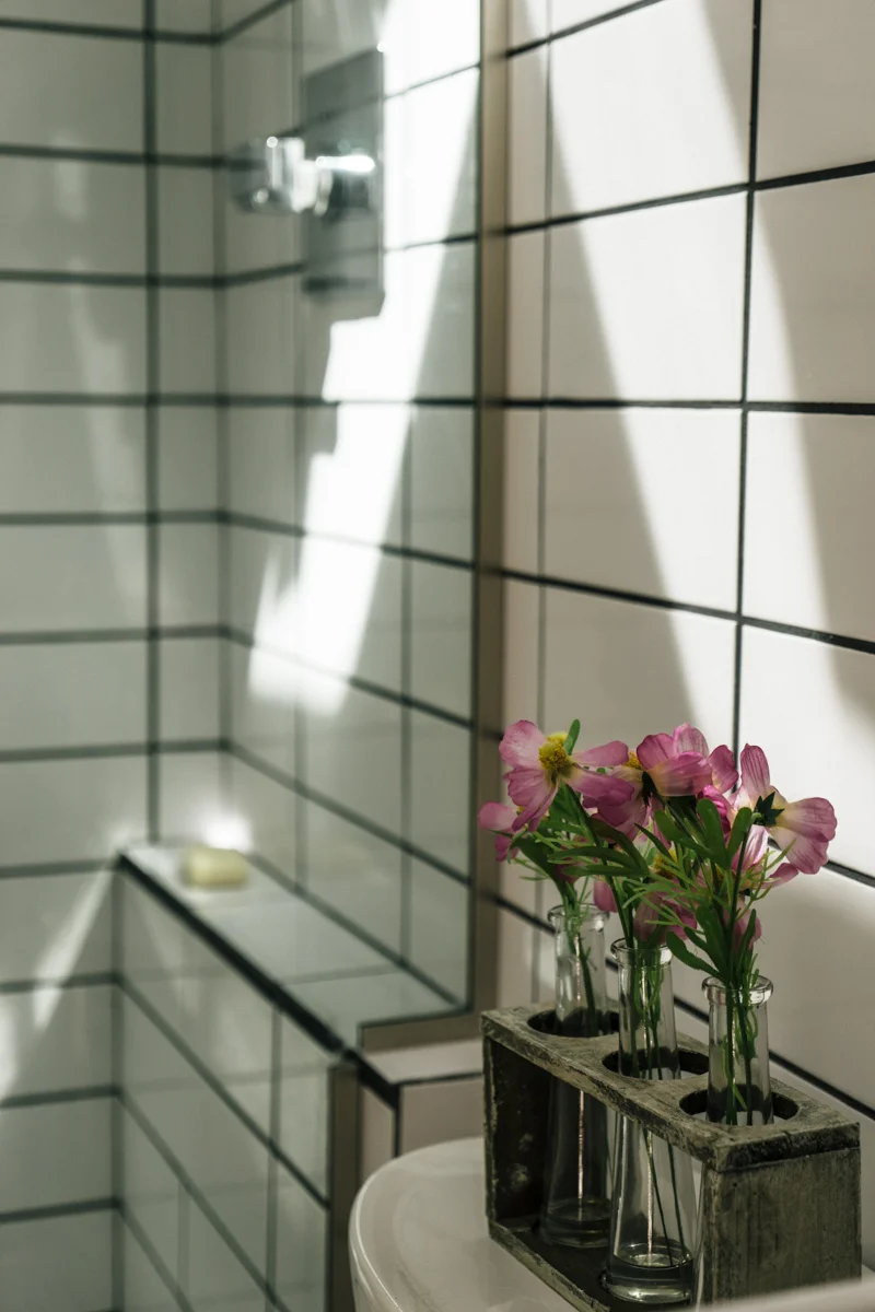 Custom glass partition for the shower keeps the space open. 