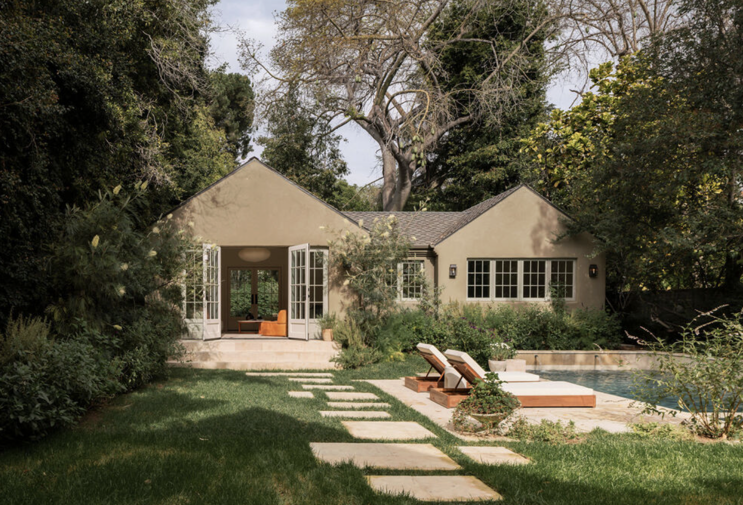 Guest house and pool at 2027 Laughlin Park Drive in Los Feliz with mature landscaping and modern outdoor living