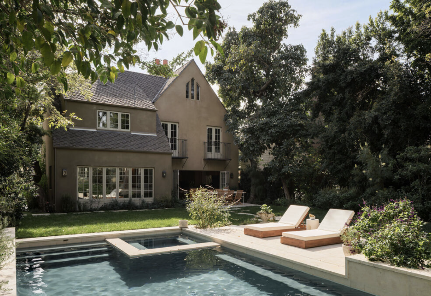 Pool and spa at Laughlin Park estate with guest house and privacy hedges in Los Feliz Los Angeles