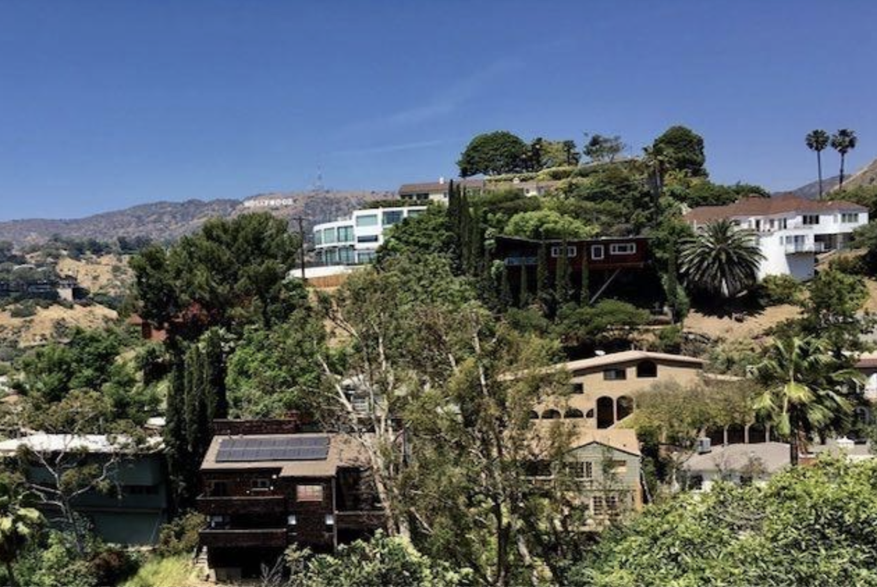 A 1925 Tudor Revival house on Live Oak Drive in the Los Feliz Oaks, set among mature coast live oaks.