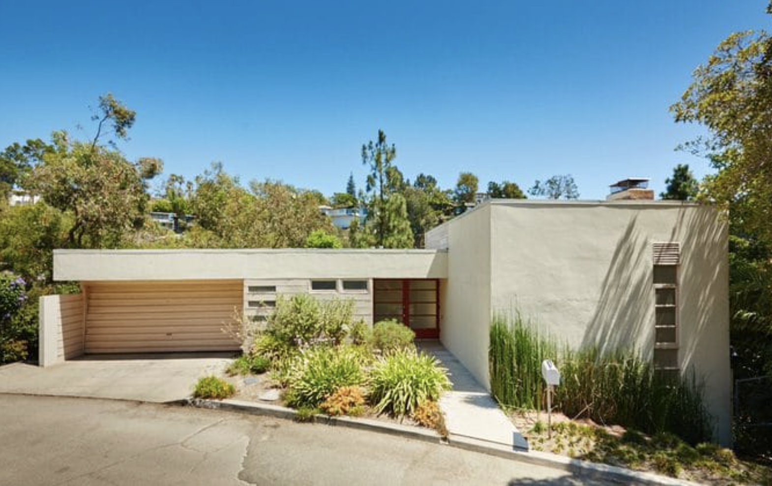 The Ernst House by Gregory Ain at 5670 Holly Oak Drive, a 1937 modernist home on a hillside lot in the Los Feliz Oaks neighborhood of Los Angeles