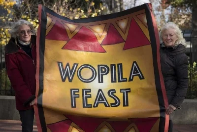  CLEM MURRAY / STAFF PHOTOGRAPHER Artist Lou Ann Merkle (left) and Judy Wicks, late of the famed White Dog Cafe, hold a banner Merkle painted that they will be taking out to Standing Rock Sioux Reservation in North Dakota to stand in support of those protesting the pipeline. Wicks has arranged donations to feed 2000 people a Thanksgiving dinner. The word Wopila means Thanks in Lokato language. Photo taken November 21, 2016.