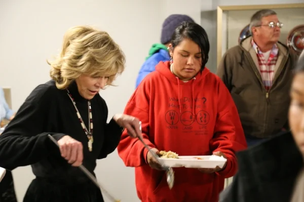 Jane Fonda serving mashed potatoes.