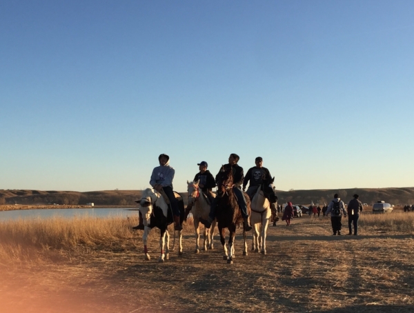 Native youth patrolling the borders of camp.