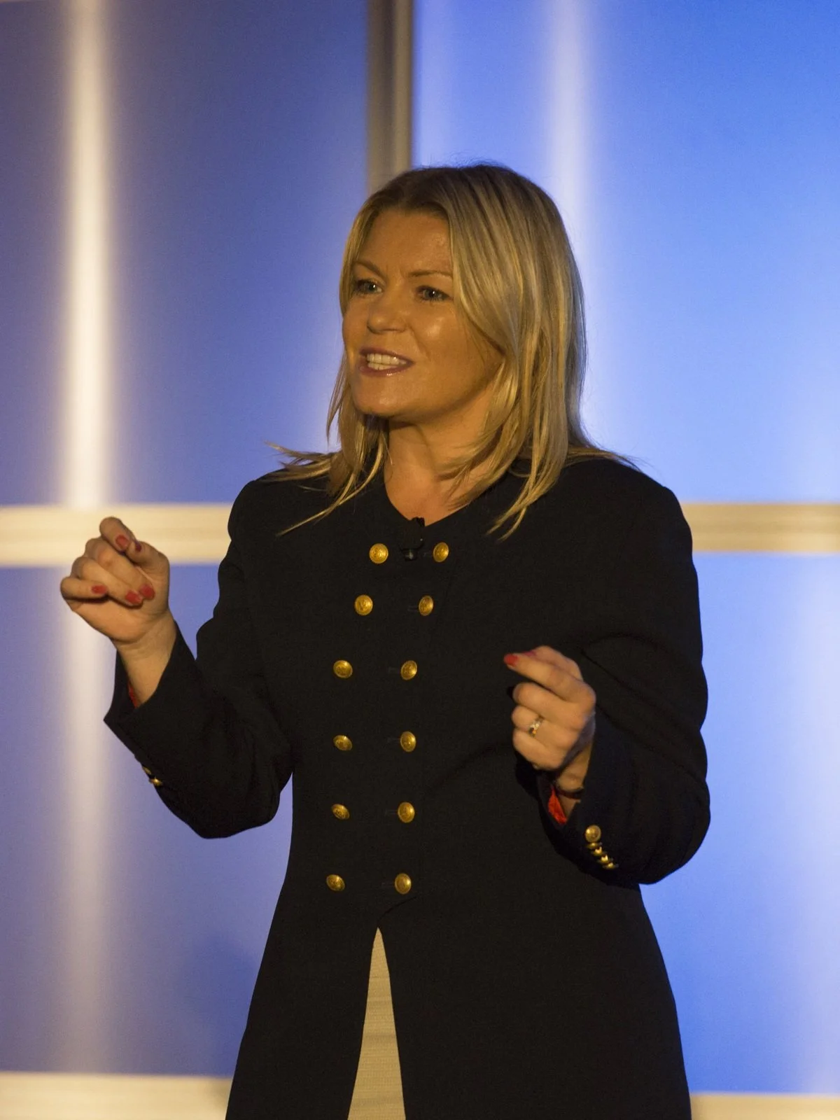 Val Wright speaking to a room of senior executives