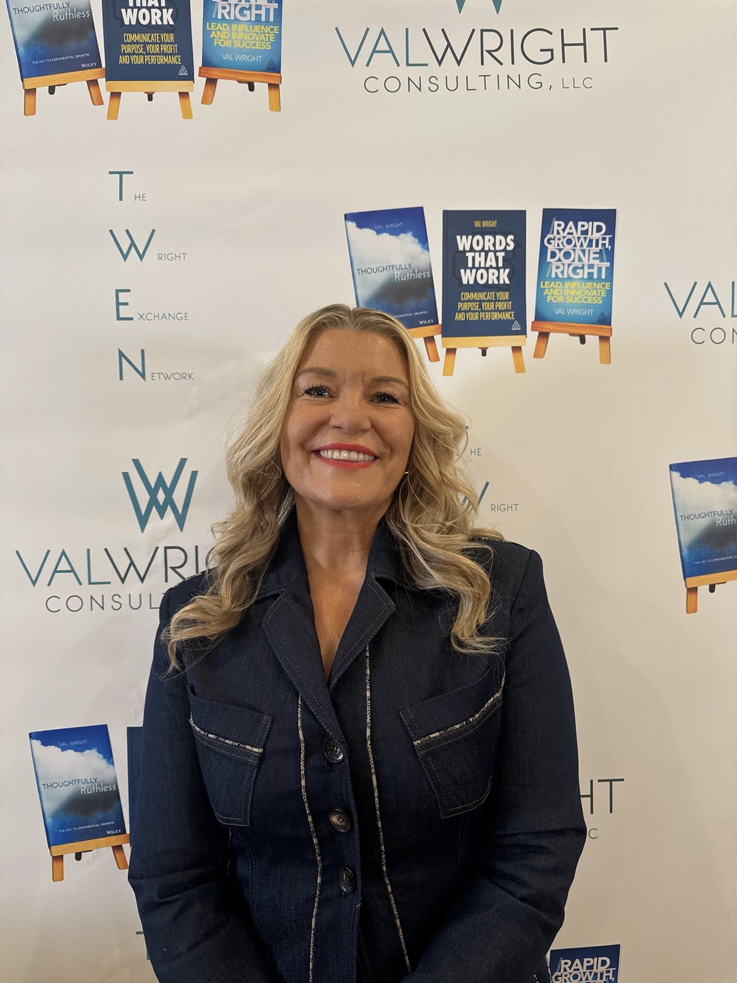 Val Wright with three books backdrop
