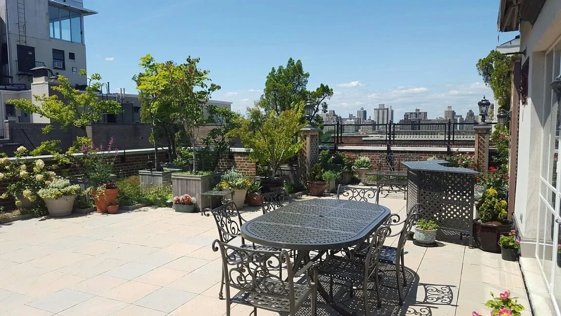 Every HWA garden is designed in partnership with our clientele, incorporating their desired aesthetic and use of the space. In this case, clusters of artfully arranged planters bring whimsy and depth to this rooftop terrace perfect for outdoor dining
