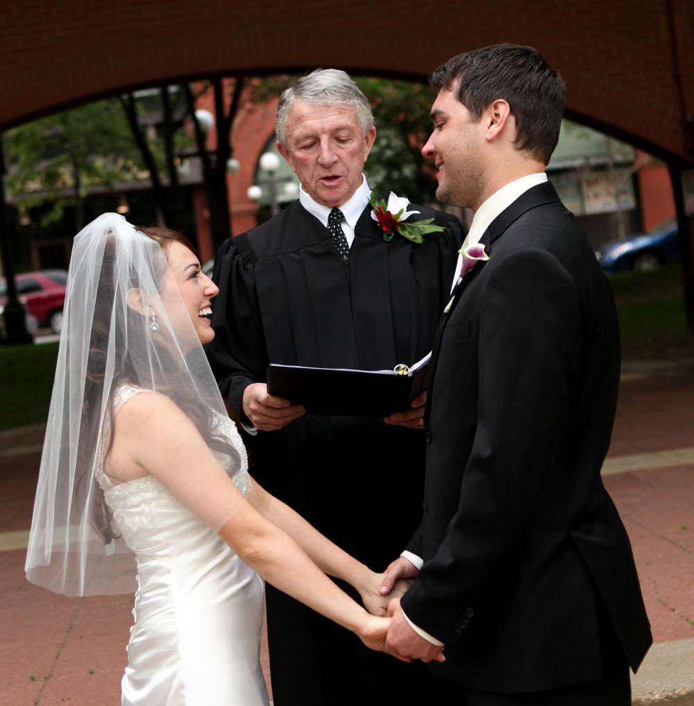  Bride &amp; Groom rejoice during their ceremony at Mear's Park in Lowertown St. Paul, MN. &nbsp;Officiant: Judge John Cass 