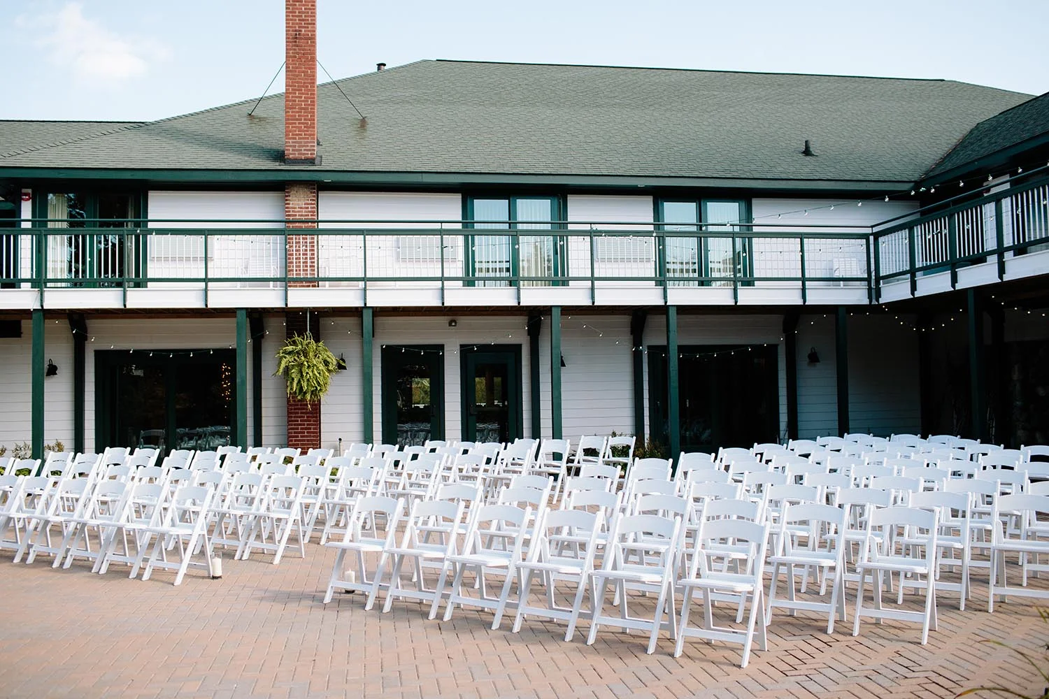 white wedding chairs ready for guests