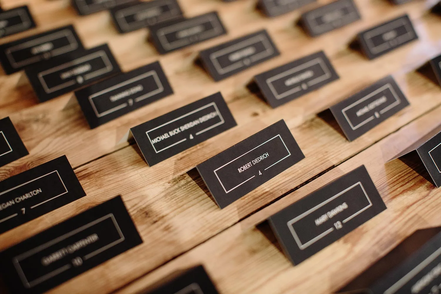 black and gold foil escort cards