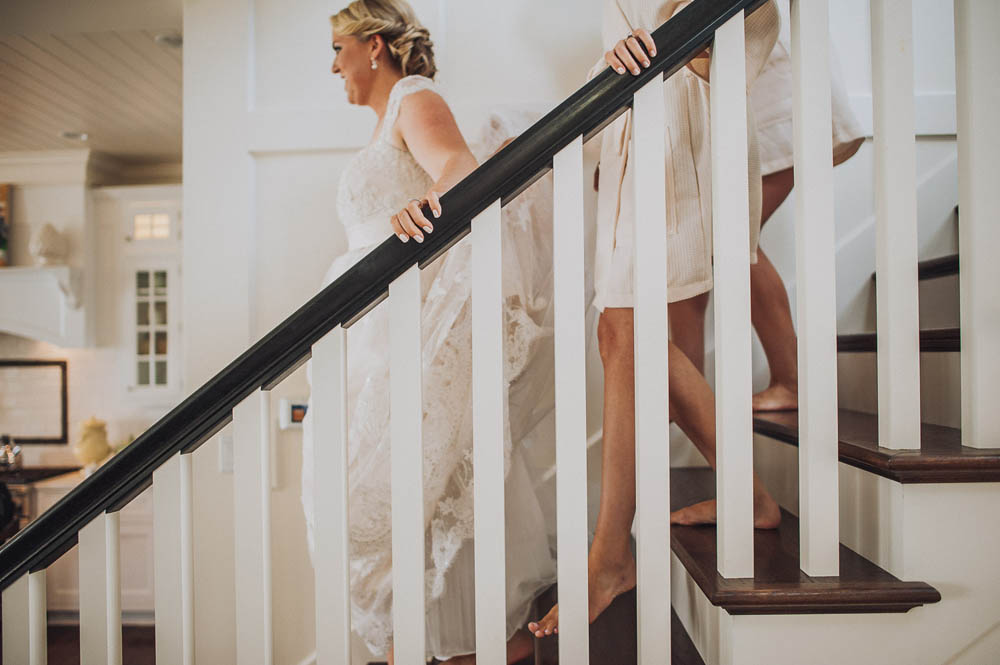 bride comes down the stairs