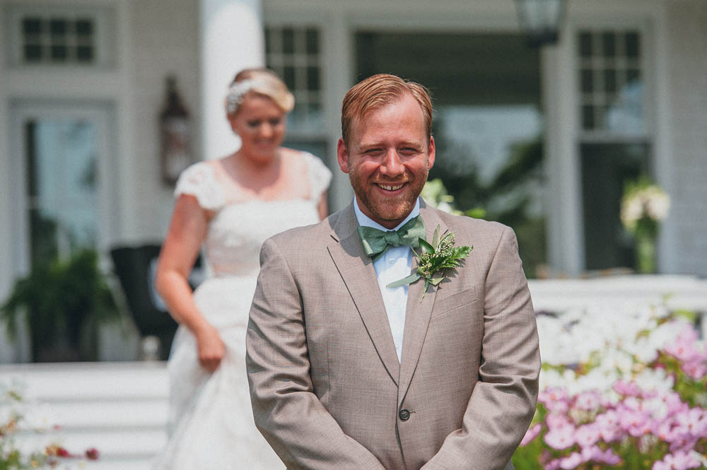 the groom waits to see the bride at the first look