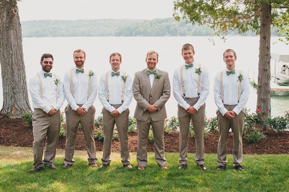 the groomsmen in suspenders and bowties