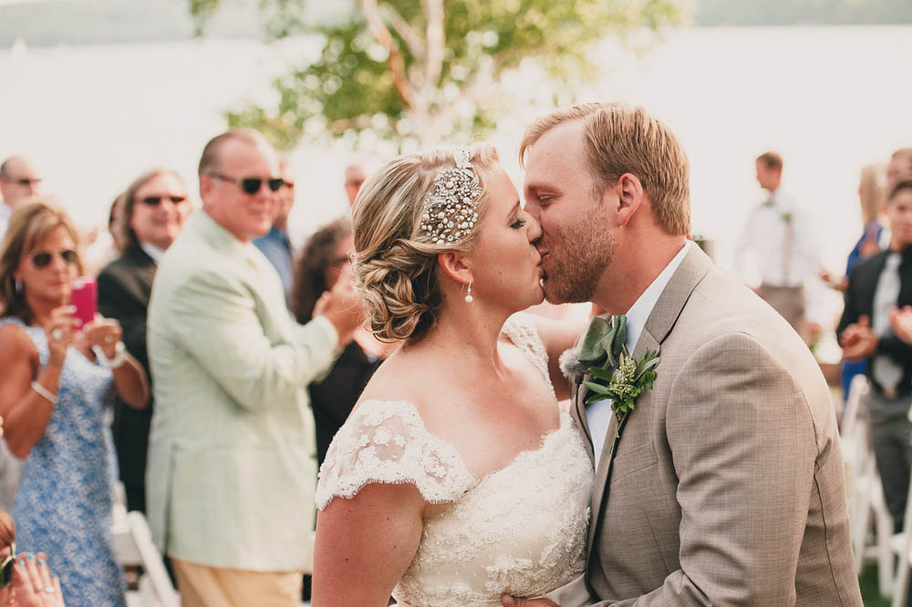 ceremony kiss at lakeside wedding