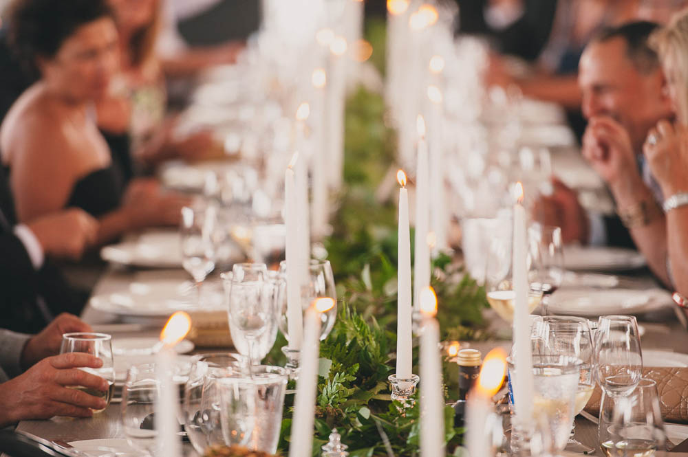candlelit table and greenery wedding runner