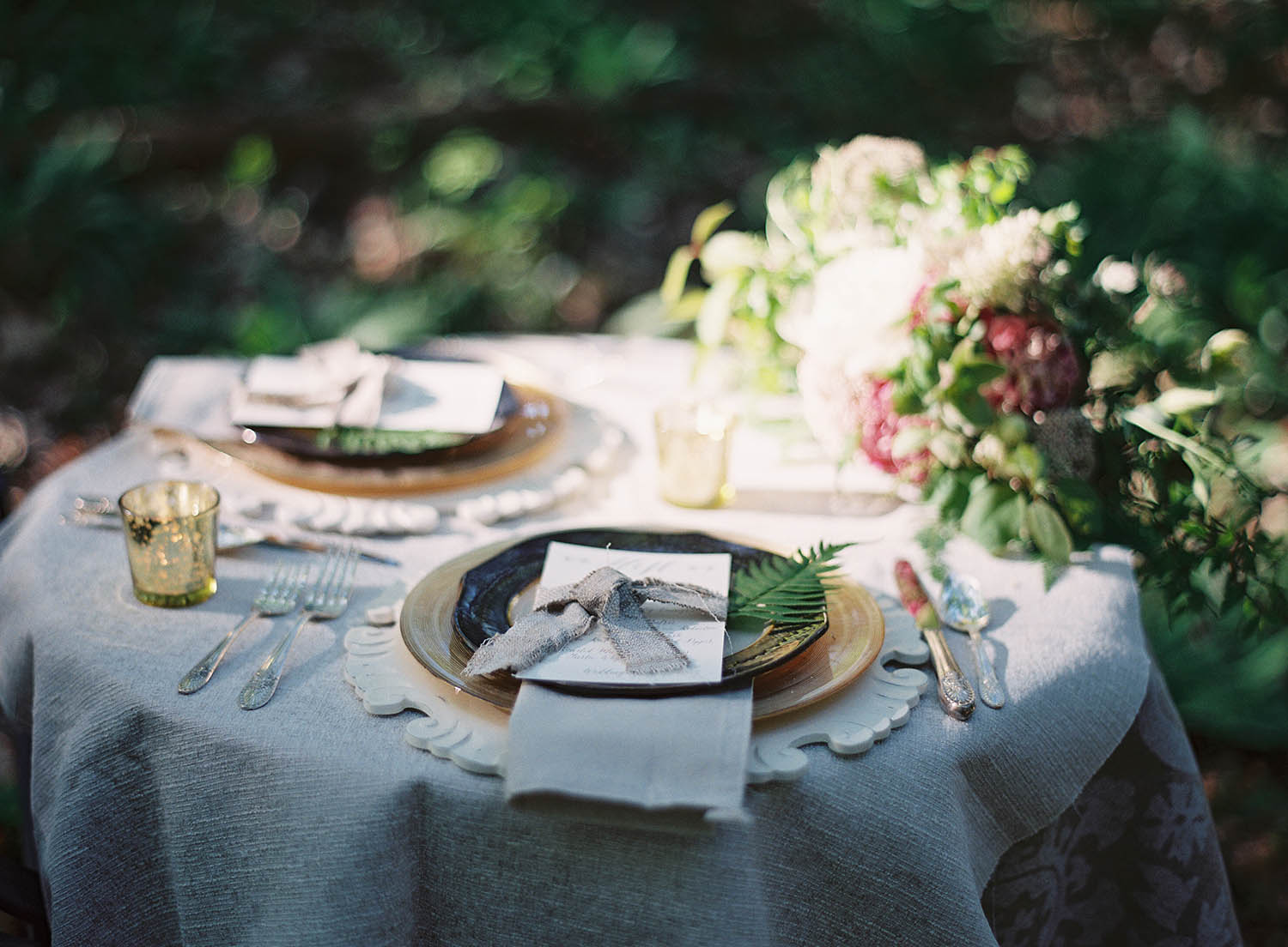 styled linen weddingscape with fern details