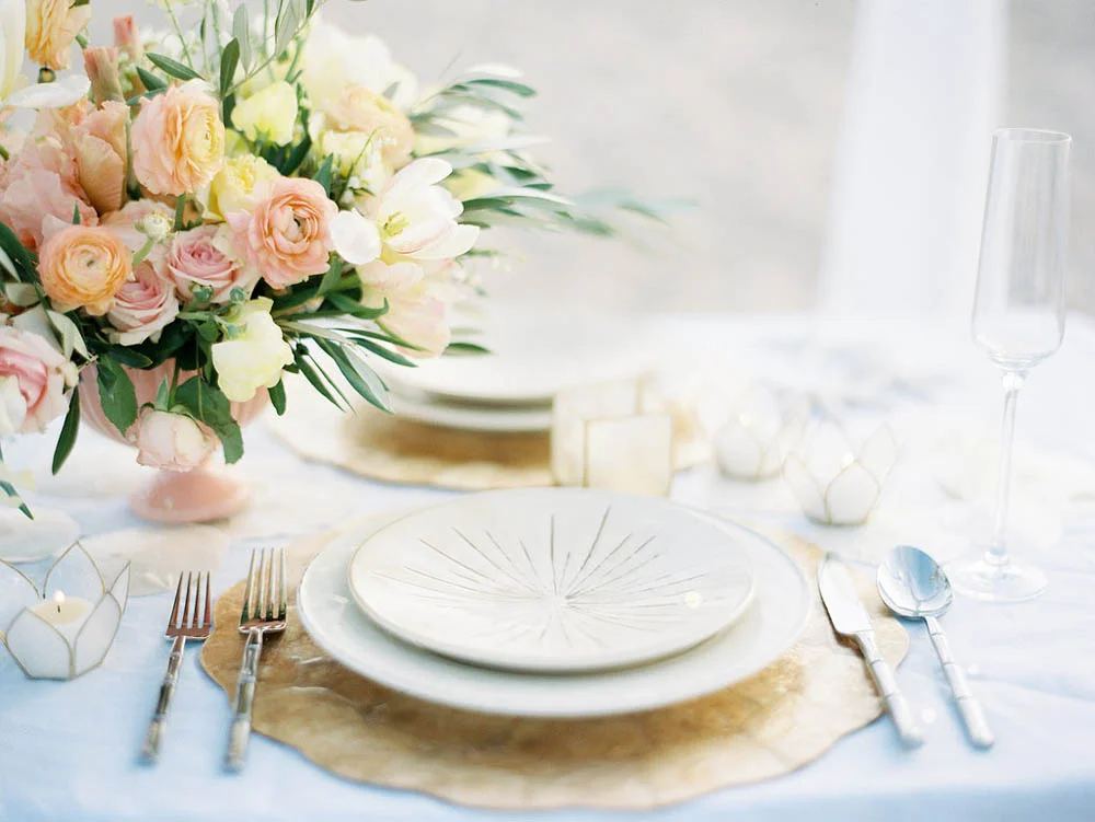 peach ranunculous and blush rose floral arrangement