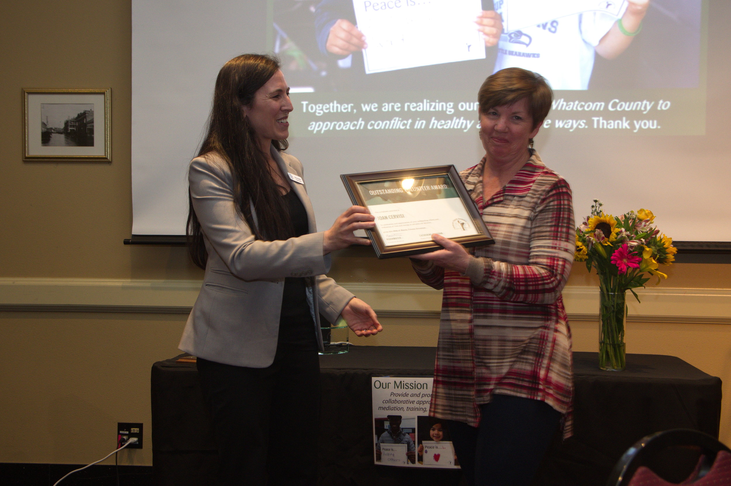 Joan Cervisi accepting her award. Photo by Bellingham Photographer Phil Rose.
