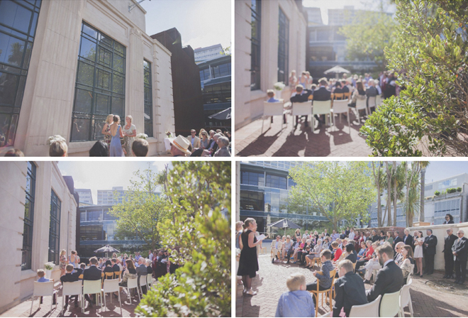 Non traditional Wedding ceremony in bright sunshine, in Wellington Civic square, with the old library building as a backdrop.