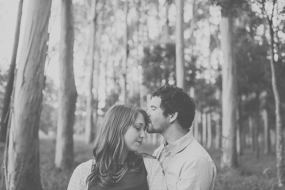 Tender kiss amongst the trees. Photography by Jenny Siaosi.